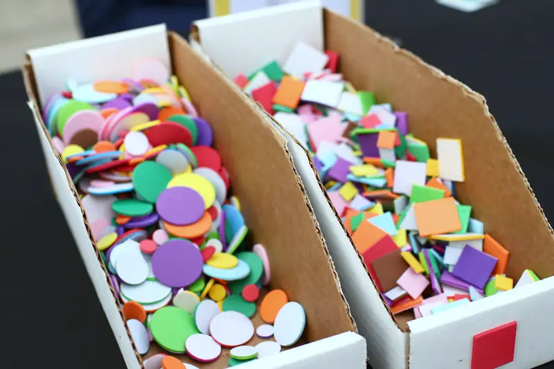 Bins of colorful foam shapes ready for building