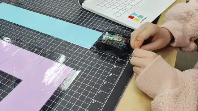 A robot drives the taped maze