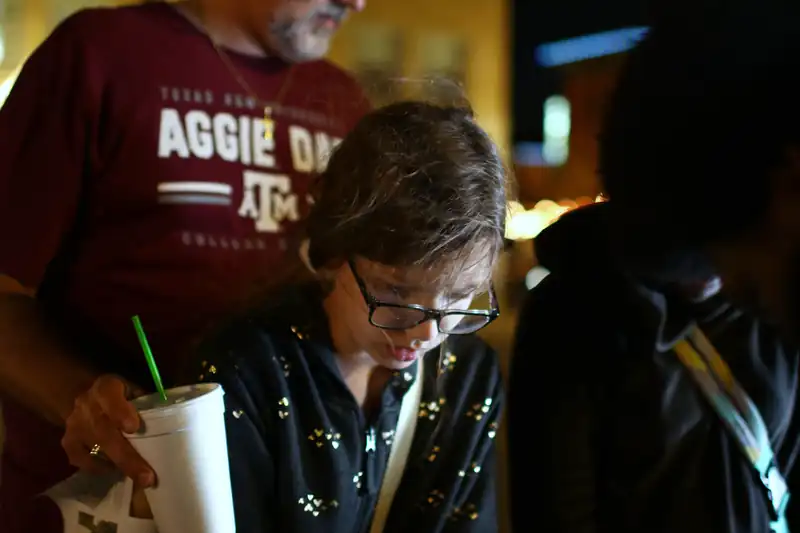 Grown-ups try the build at the table after dark